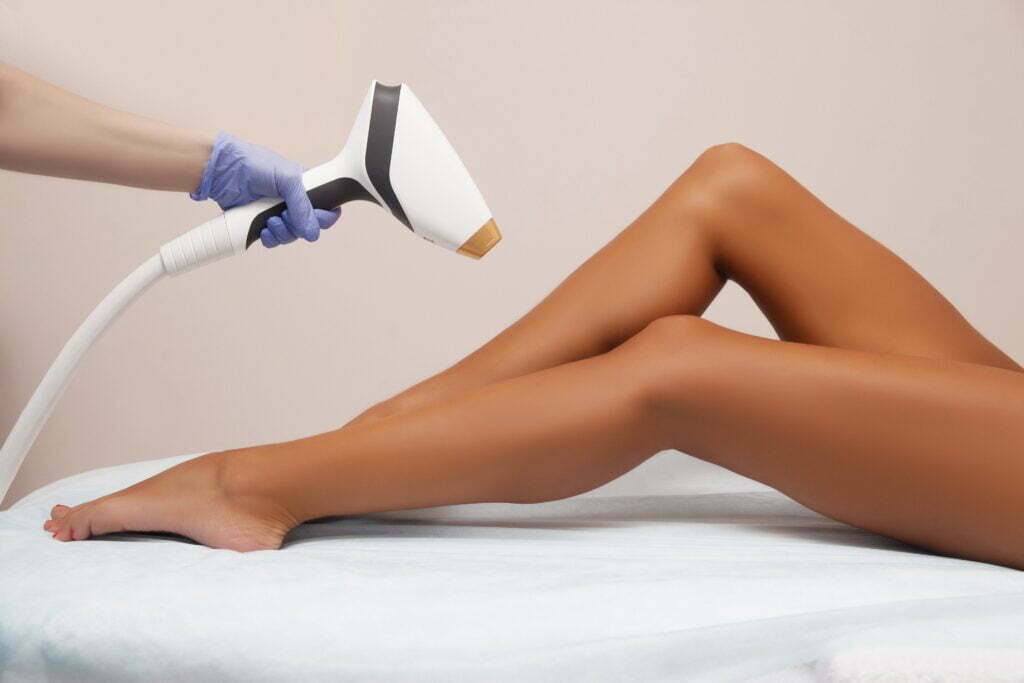 Woman receiving laser hair removal treatment