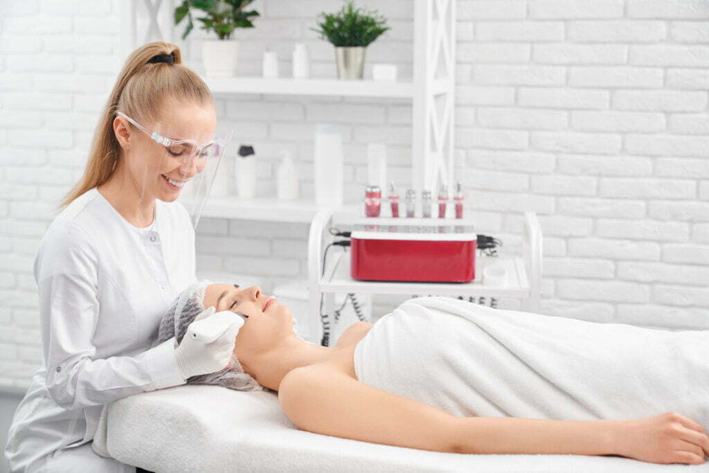 Beautician applying best anti-ageing treatment to patient