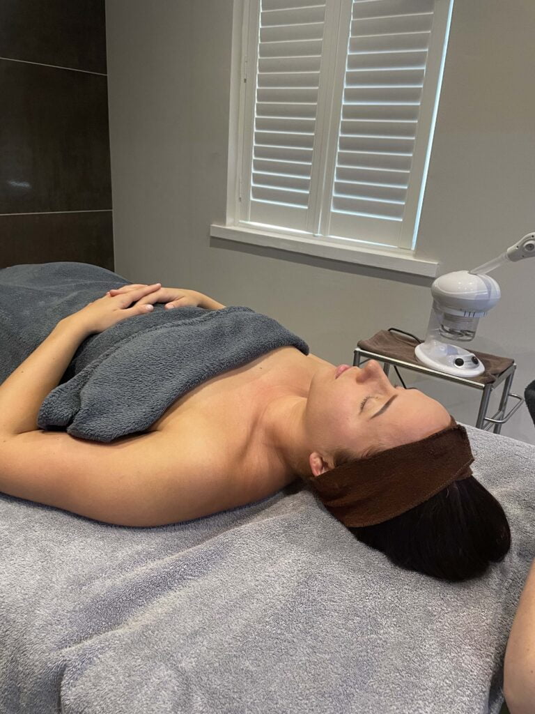 woman lying down on treatment table